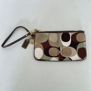 Coach Monogrammed Wristlet.